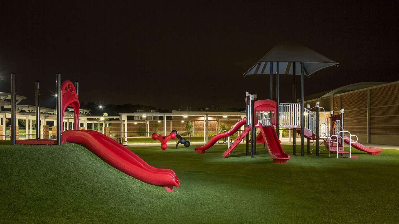 Nighttime artificial turf playground by Southwest Greens of Illinois